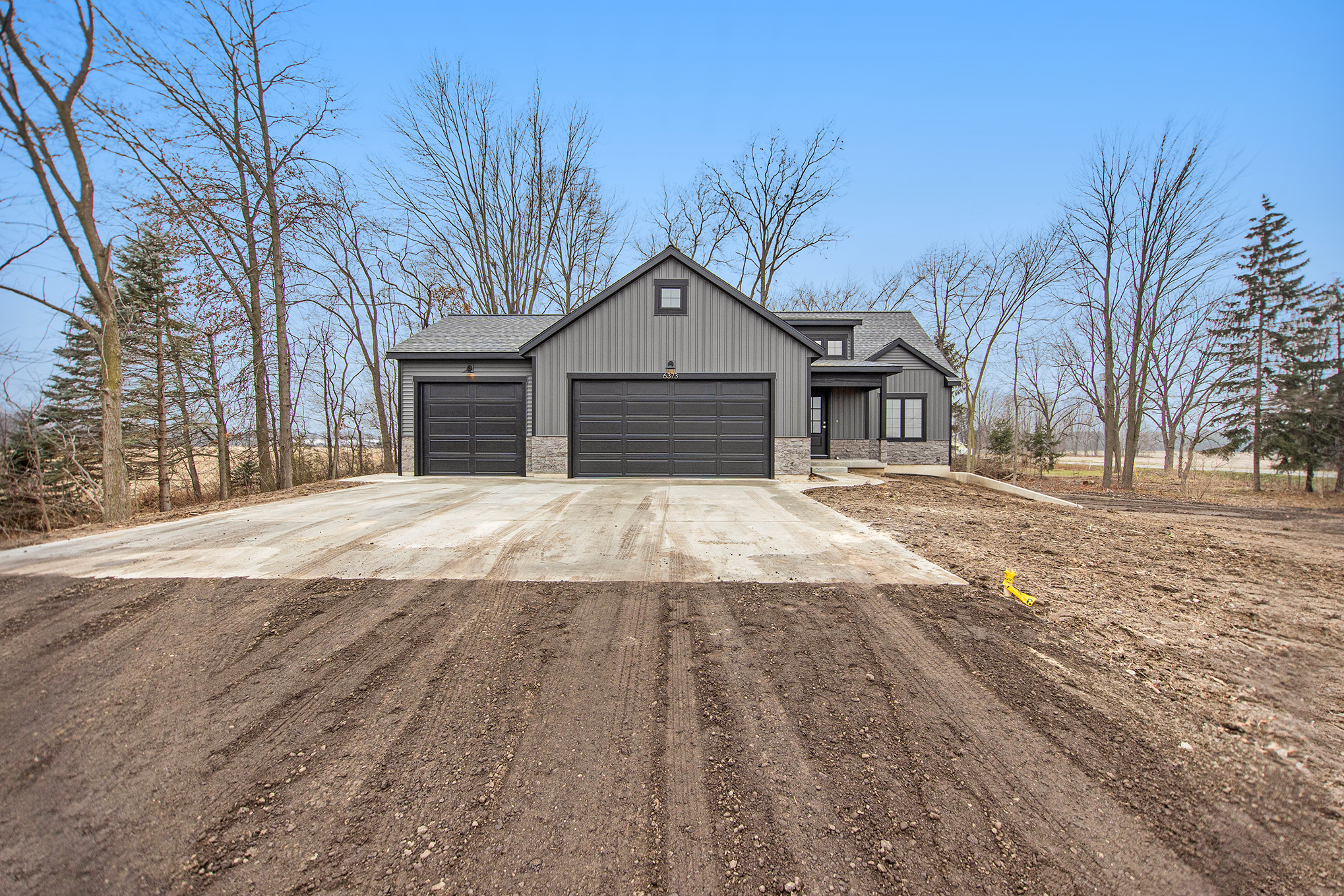 West Michigan new home with three stall garage